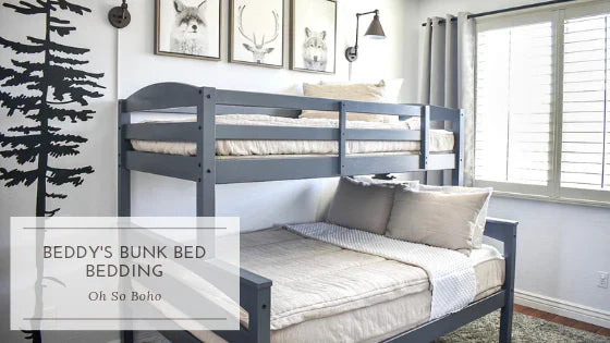 
      An infographic with a gray bunk bed with light tan zipper bedding and woodland creatures in frames above the top bunk.
    
