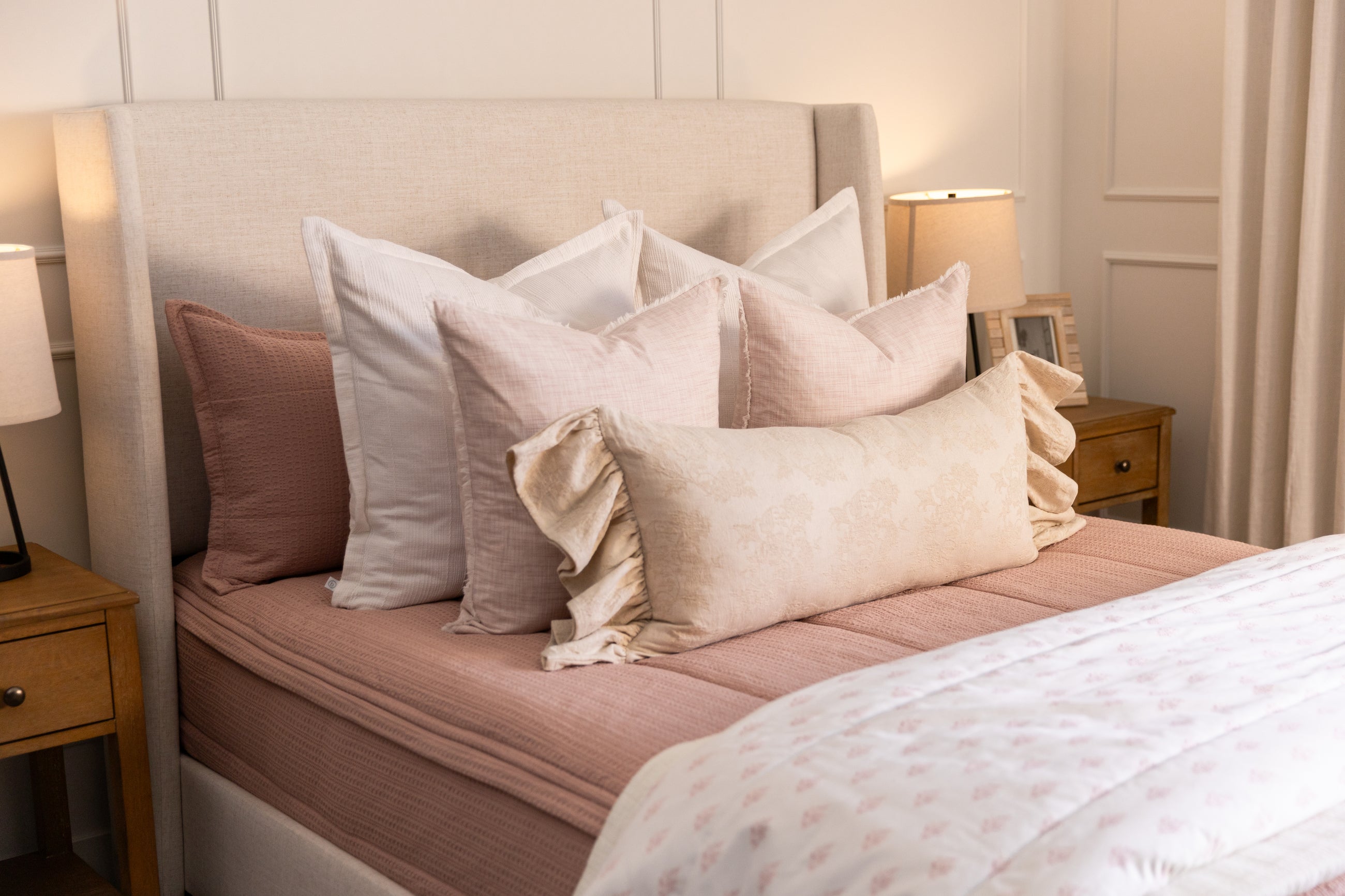 Pink zipper bedding with pink white and tan accessories