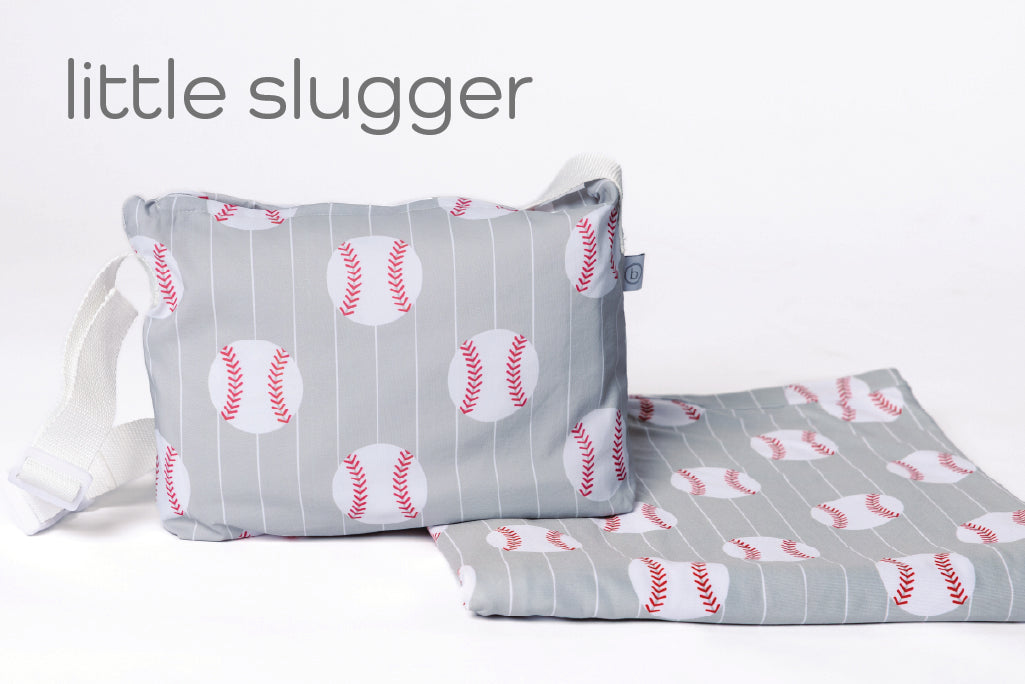 A child's baseball print blanket and coordinating zipper pouch.
