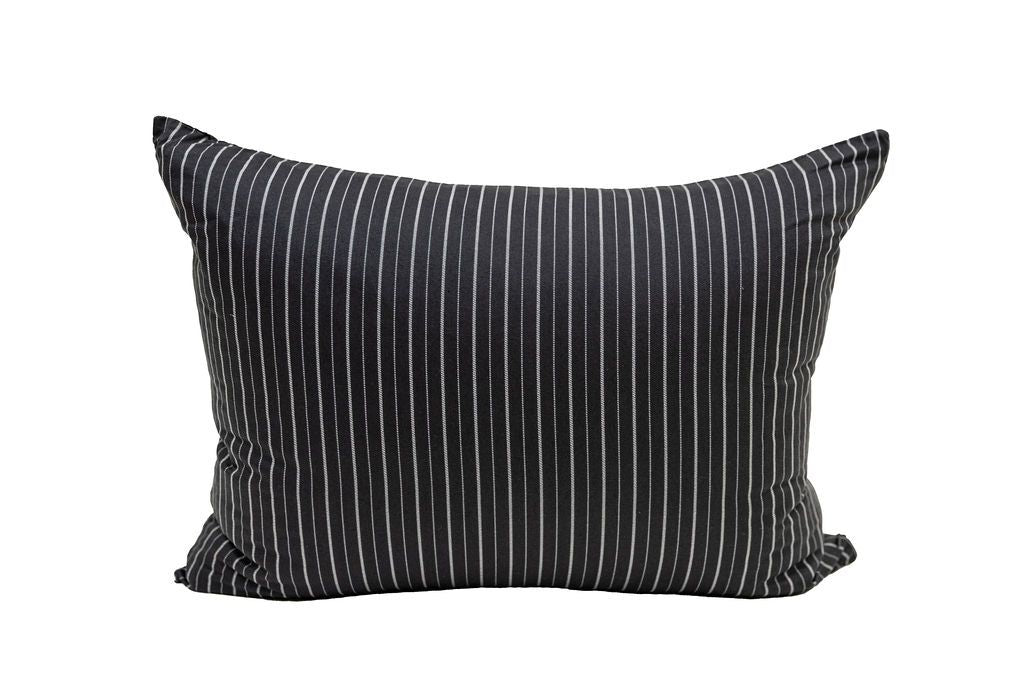 A black and white striped pillowcase. 
