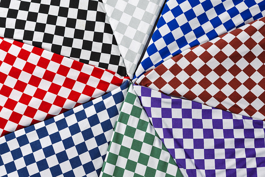 Check pattern blankets folded, lying flat. 