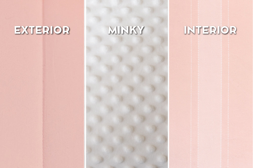 A close up view of a pink striped interior lining of a pink zipper bedding.