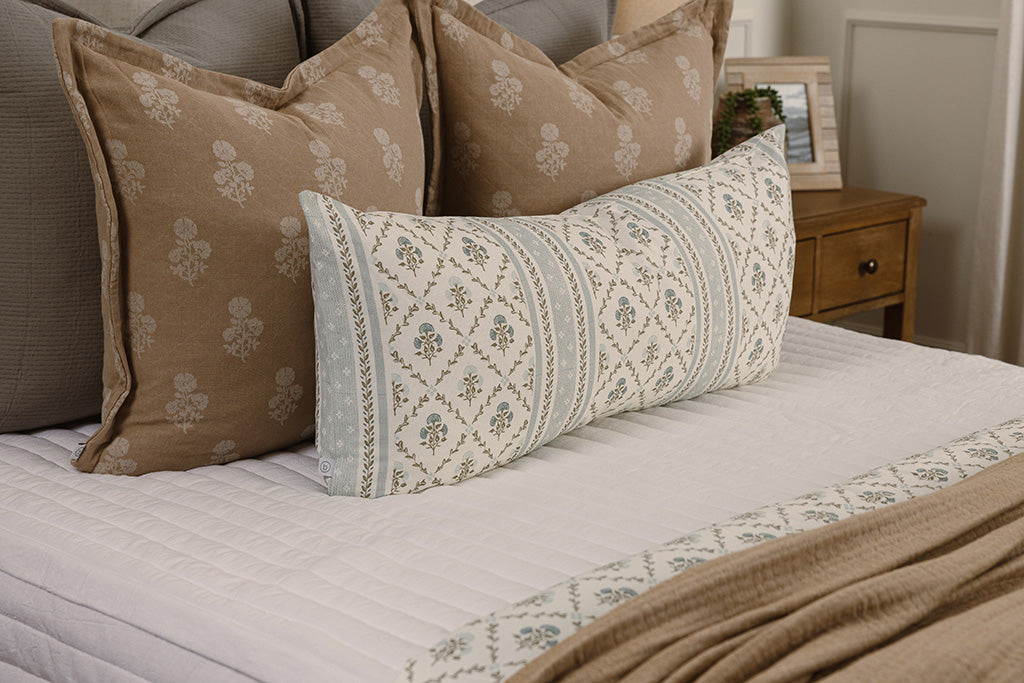 Close up photo of white stripe quilted zipper bedding.
