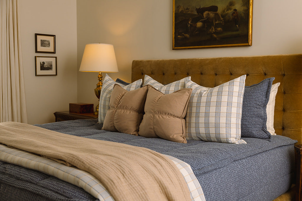 Soft, blue waffle texture zipper bedding with tan and plaid accessories.