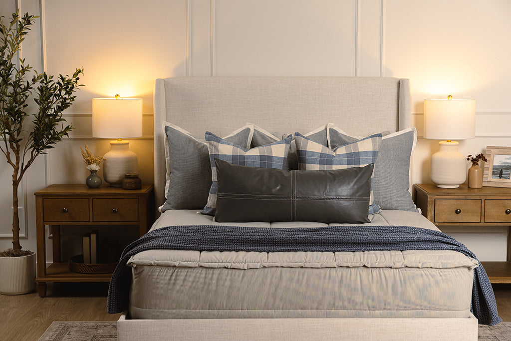 Blue and white stripe zipper bedding with grey, plaid, and blue accessories. 