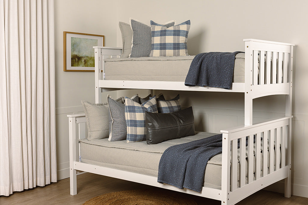 Blue and white stripe zipper bedding with plaid, grey, and blue accessories.