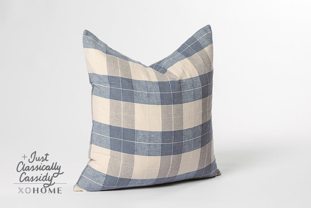 Blue plaid and cream euro on a white backdrop.