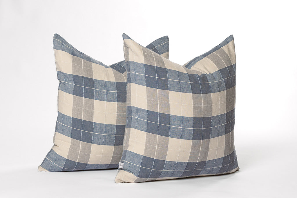 Blue plaid and cream euro on a white backdrop.