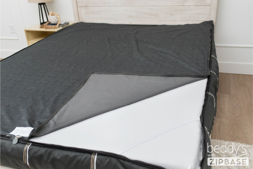 Charcoal with white and brown grid pattern bedding with zip out sheet.