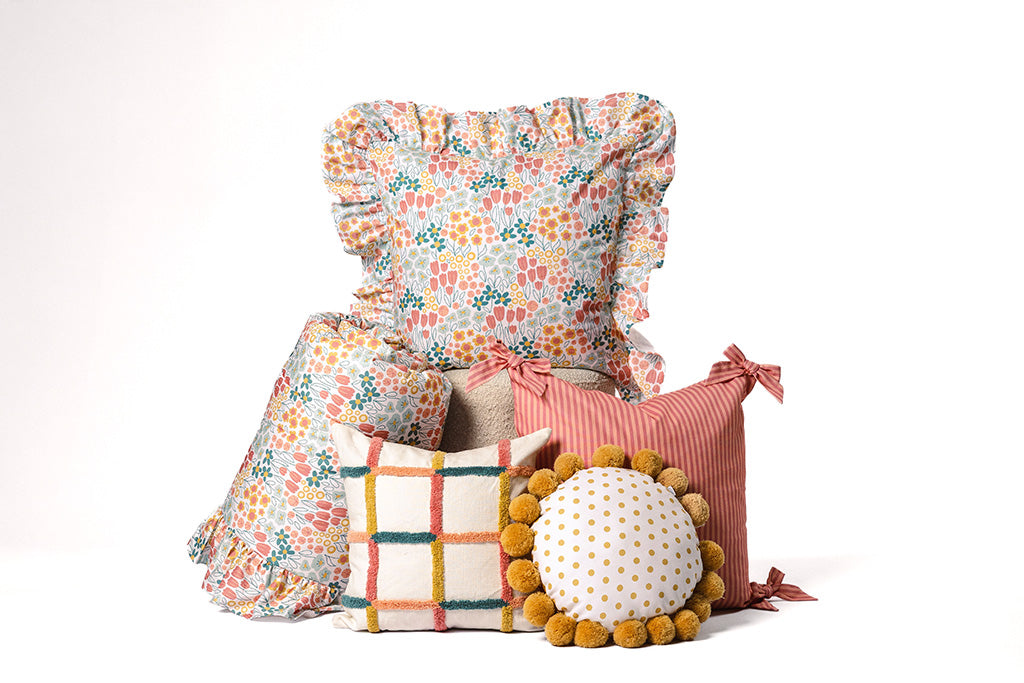 Multi-color and floral accessories on a white background. 
