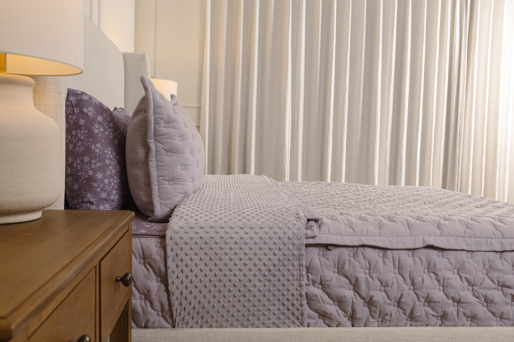 Side view of purple knitted zipper bedding.