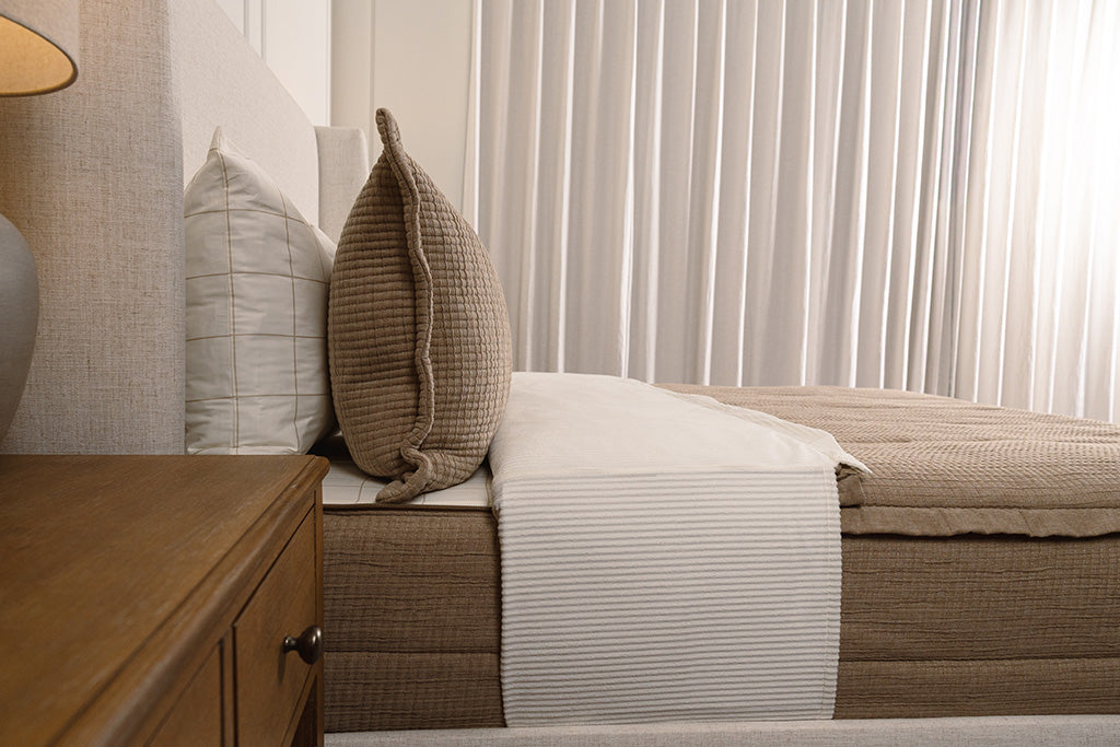 Side view of tan woven zipper bedding.