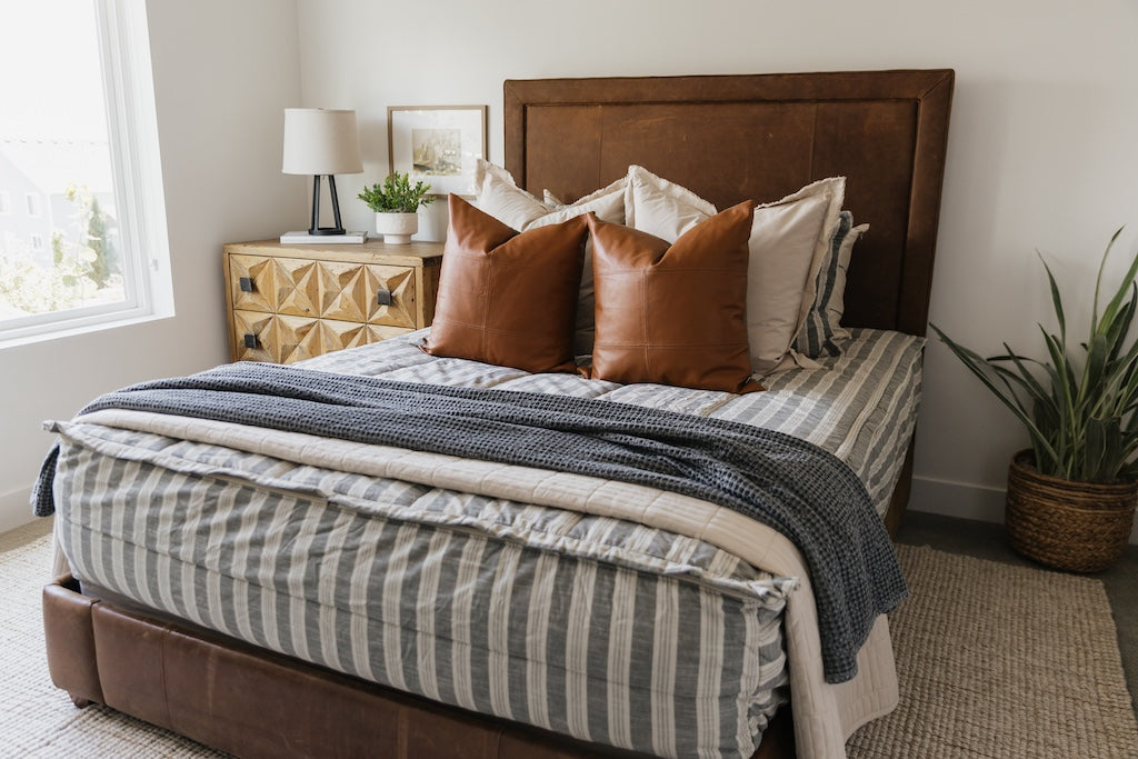 Classic stripe with calming neutrals zipper bedding with tan, gray and rustic accessories.