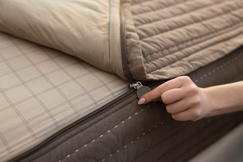 A close up of the zipper feature on a set of Beddy's zipper bedding